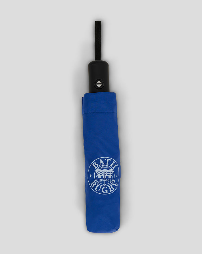 Blue Bath Rugby telescopic umbrella with black handle and wrist strap folded in its blue cover