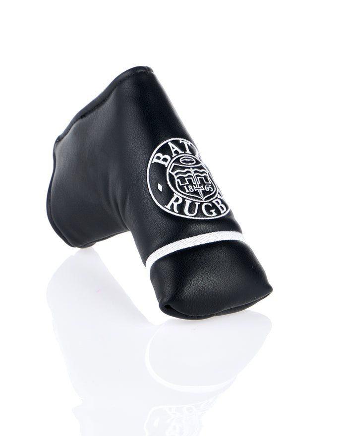 Close up of black leather head cover showing Bath Rugby crest and white piping on the band