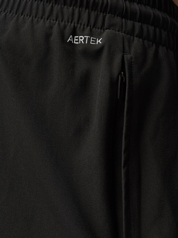 Close up of black Adapt Training 6in shorts waistband featuring AERTEK branding and a side zip pocket