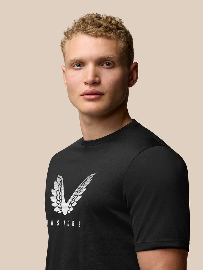 Front view of a man wearing black Adapt Training T-Shirt with white Castore wings graphic on chest