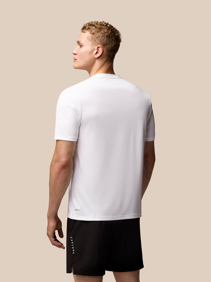 Back view of white Adapt Training T-Shirt on a male model showing Aertek branding at the lower back.