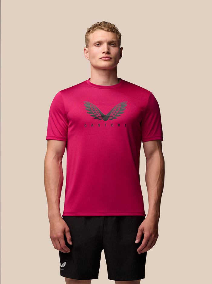 Front view of pink Adapt Training T-Shirt with Castore wings graphic on the chest