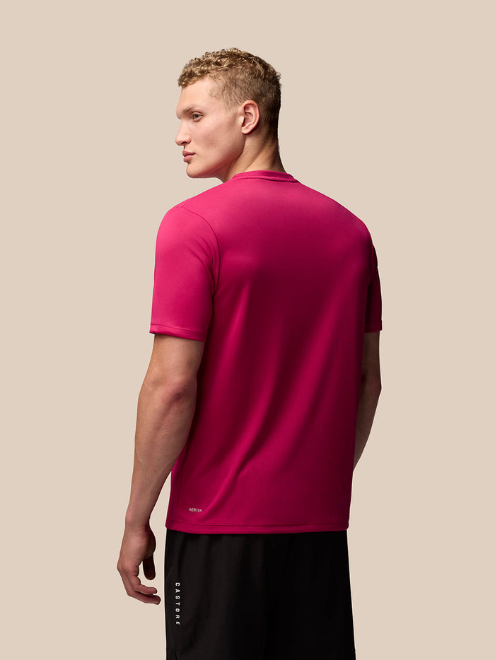 Back view of pink Adapt Training T-Shirt showing AerTek branding at the lower back