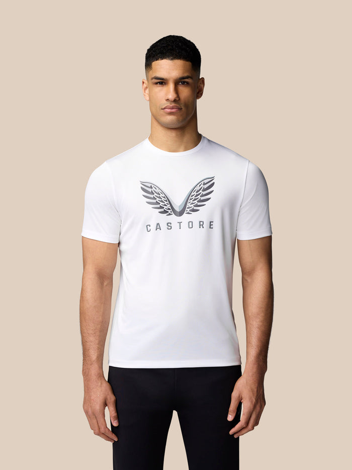 Front view of a man wearing a white Castore graphic training T-shirt with a bold chest logo
