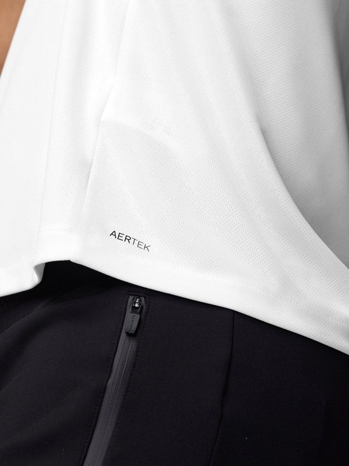 Close up of white training T shirt showing Aertek branding at the lower back hem
