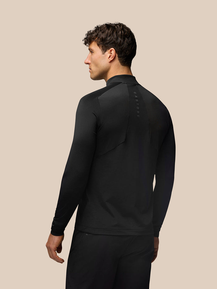 Back view of the black Apex Training Top showing vertical Castore branding along the upper back.