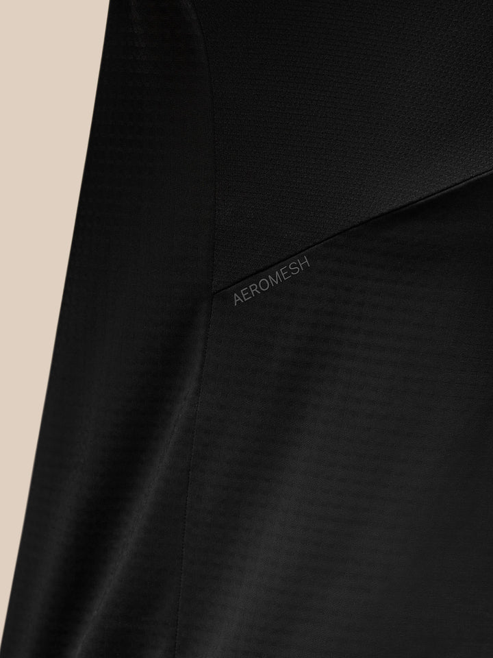 Close-up of black Apex Training Quarter Zip Top fabric with Aeromesh panel