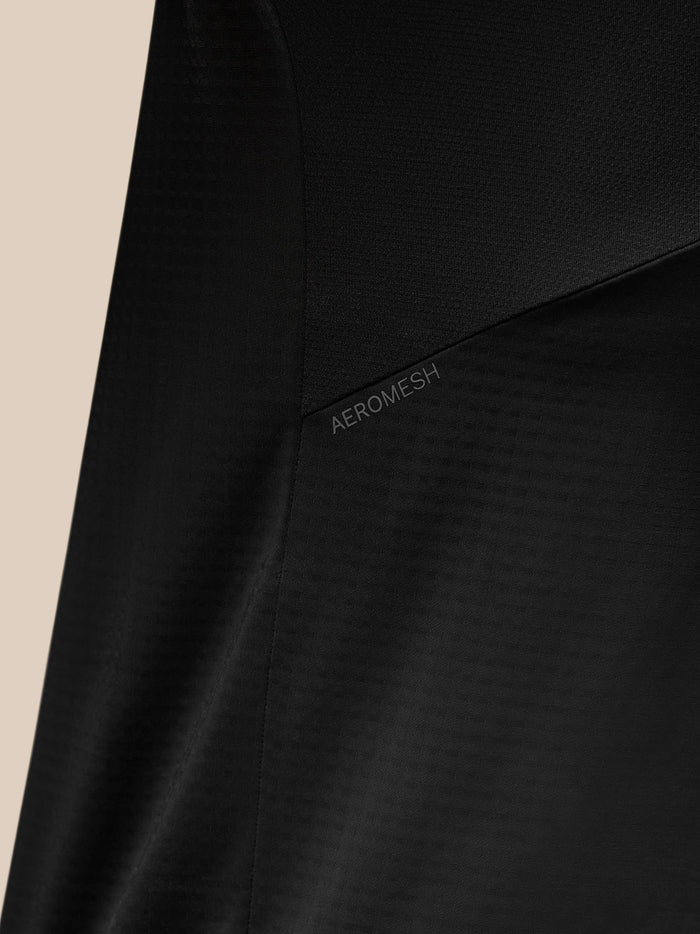 Close-up of black Apex Training Quarter Zip Top fabric with Aeromesh panel