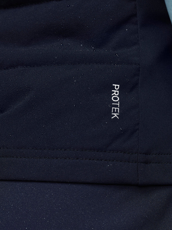 ProTek branding on navy Apex Training Gilet fabric near the chest.