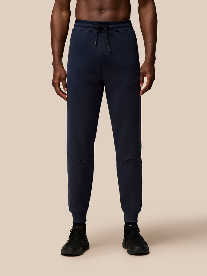 Back view of navy Flex Lifestyle Joggers on a model showing Protek branding at the waistband