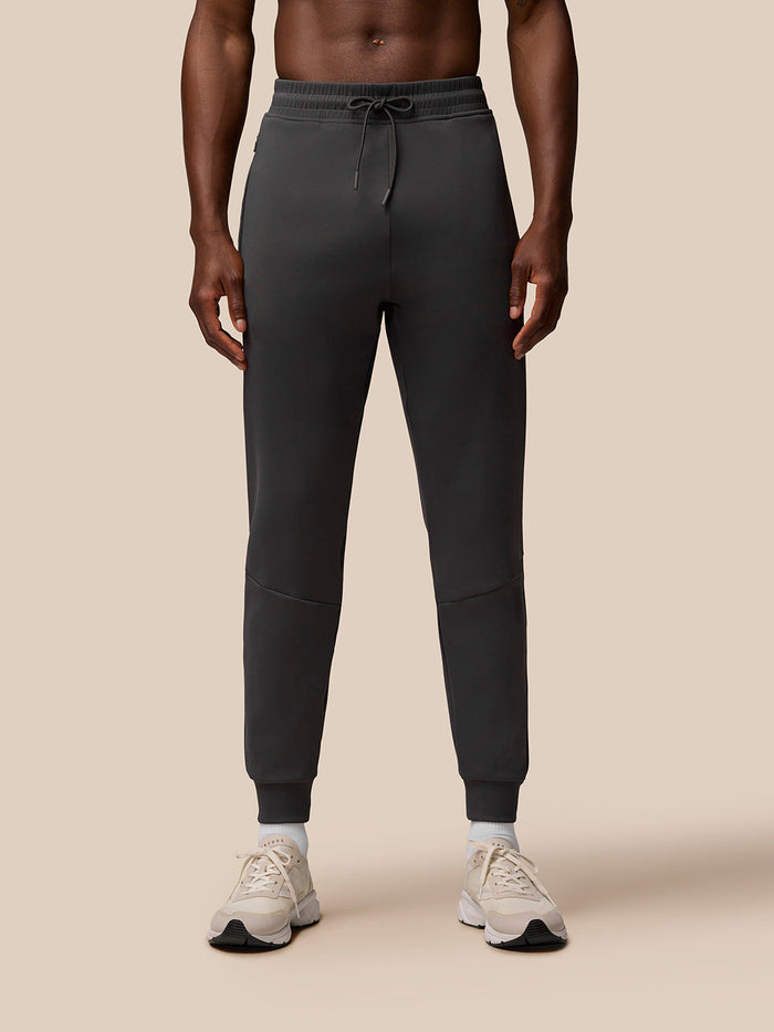 Charcoal Flex Lifestyle Joggers with vertical CASTORE lettering on the left thigh and drawstring waistband.