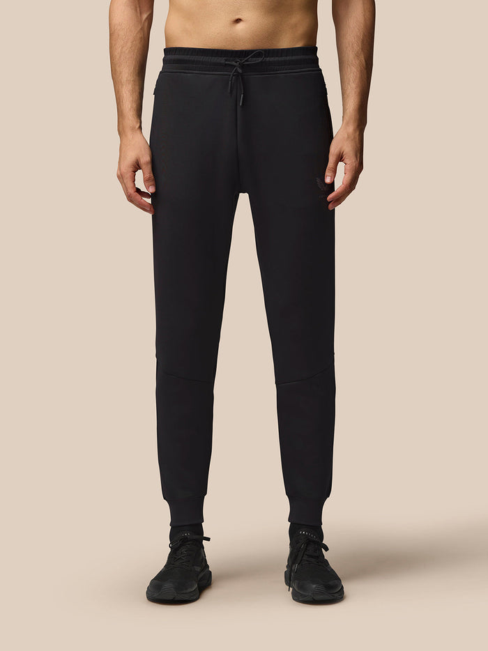 Front view of black Flex Lifestyle Joggers on a model with drawstring waist and tapered cuffs