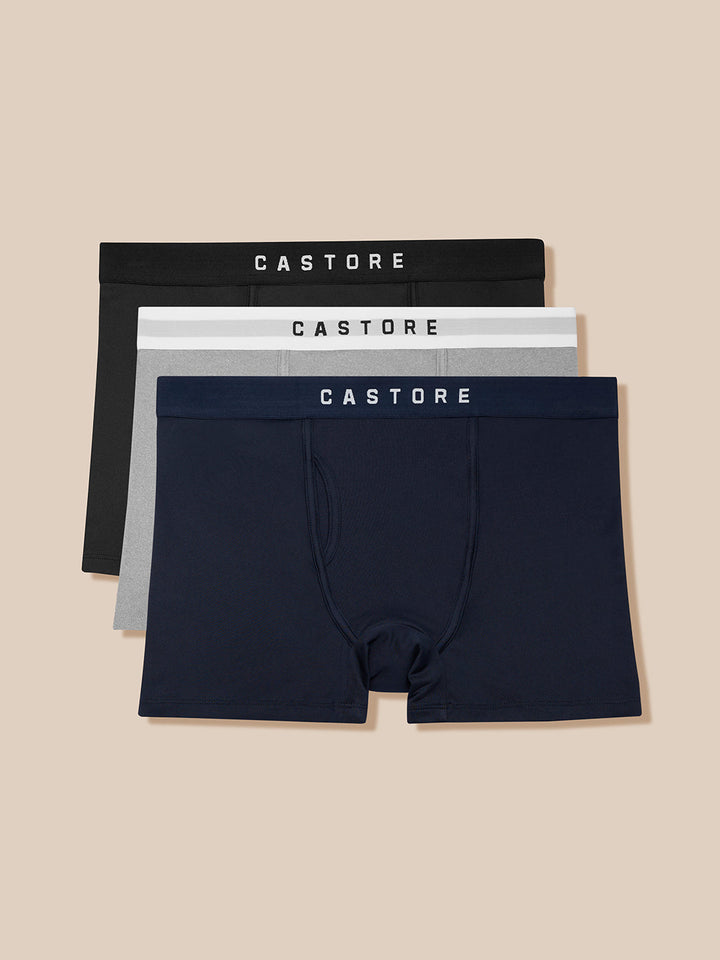 Three-pack of Castore Active boxer shorts in black grey and navy with branded waistbands.