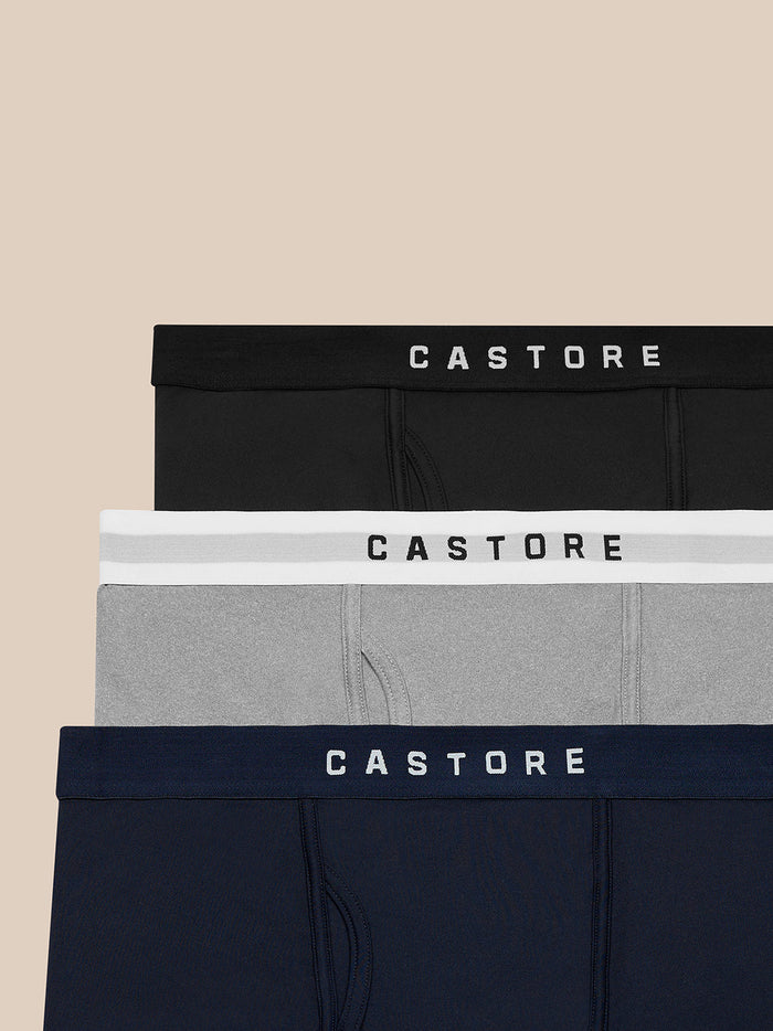 Castore Active boxers in black white gray and navy with branded elastic waistbands stacked