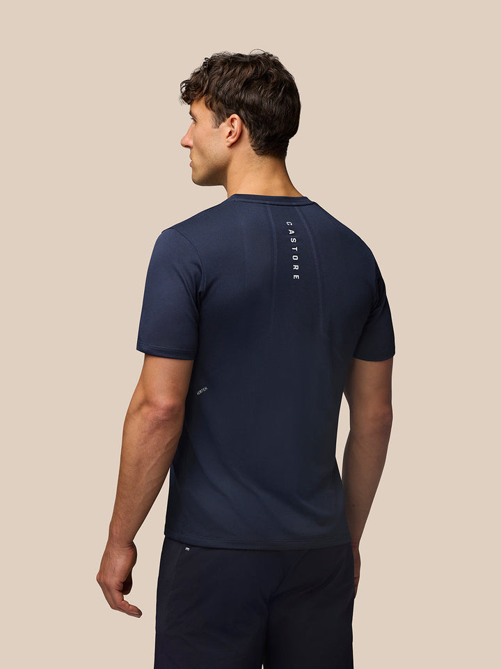 Back view of midnight navy Apex Training T-Shirt with vertical Castore branding along the upper back