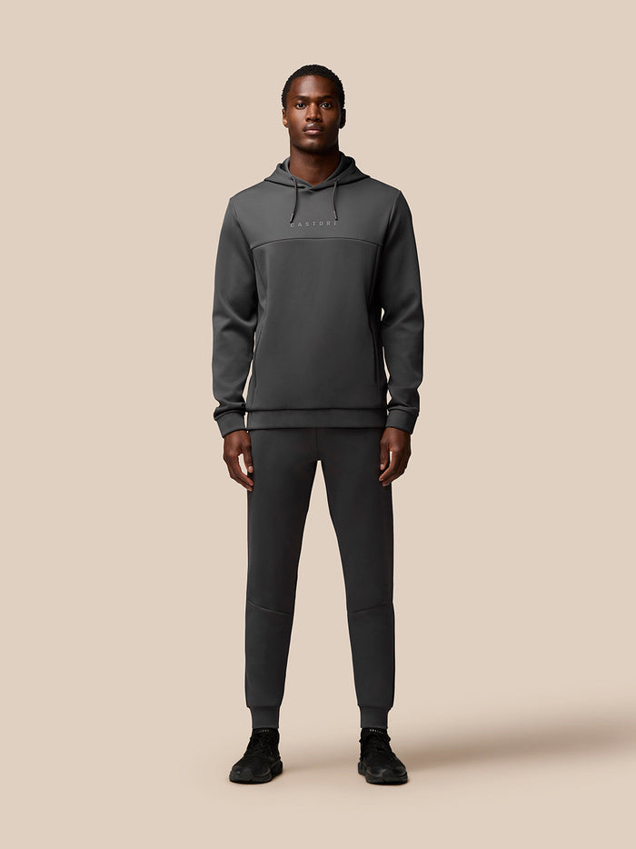 Full-body shot of model wearing Charcoal Flex Lifestyle Hoodie with matching joggers.