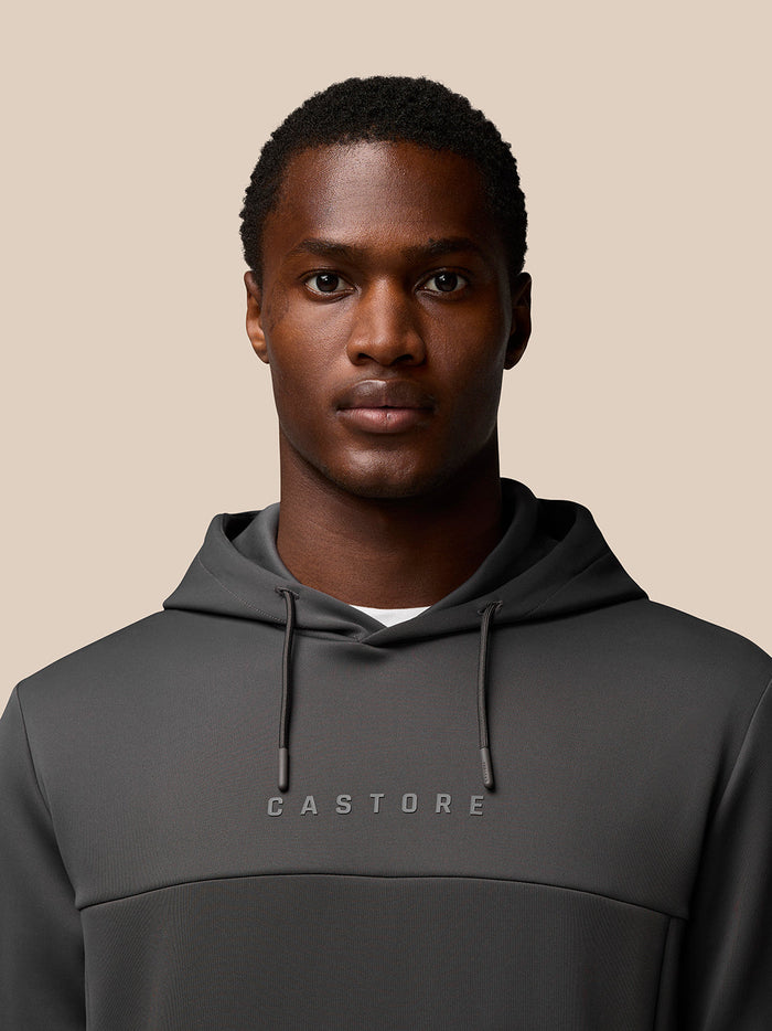 Male model wearing Charcoal Flex Lifestyle Hoodie with Castore logo on chest.