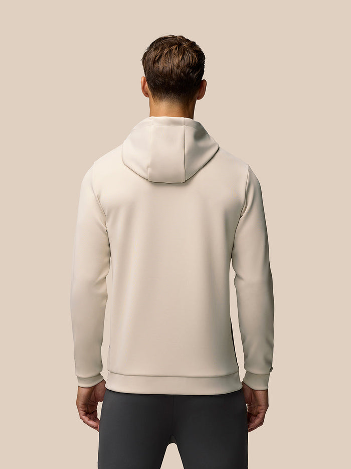 Back view of a beige Flex Lifestyle Hoodie with hood up on a model