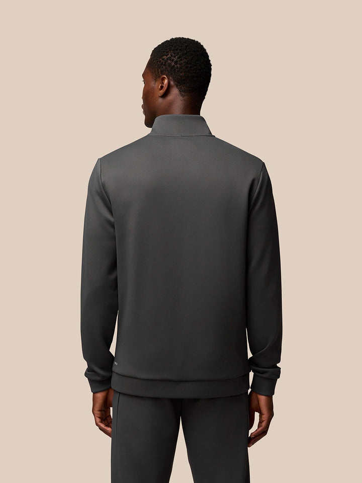 Back view of male model wearing charcoal Flex 1/4 Zip Sweatshirt