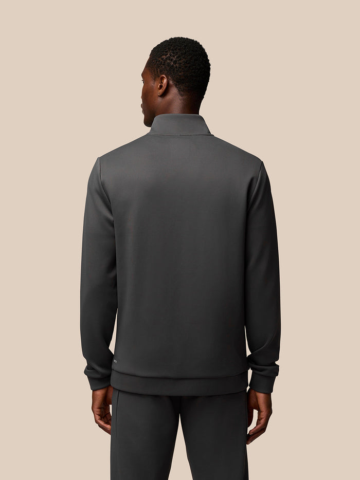 Back view of male model wearing charcoal Flex 1/4 Zip Sweatshirt