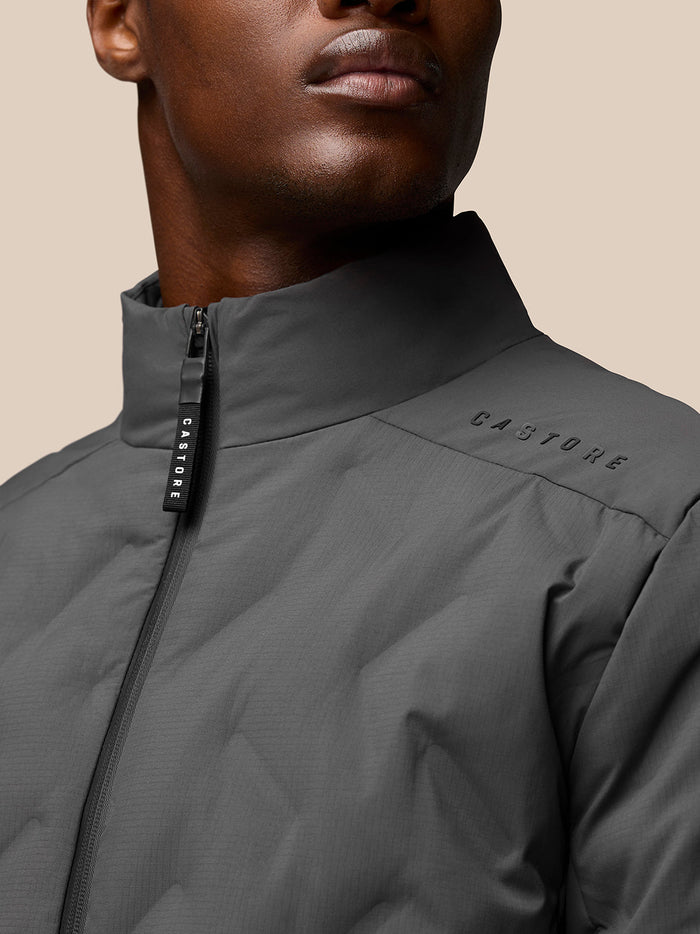 Close up of Quilts Lifestyle Jacket shoulder and collar with Castore branding.