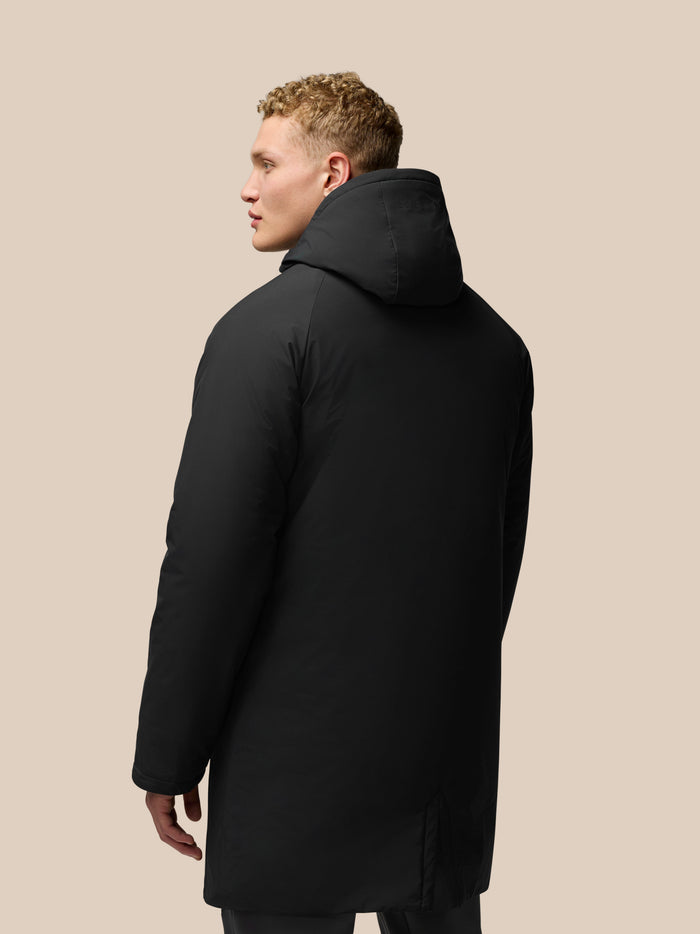 Back view of black Longline Wadded Jacket with hood