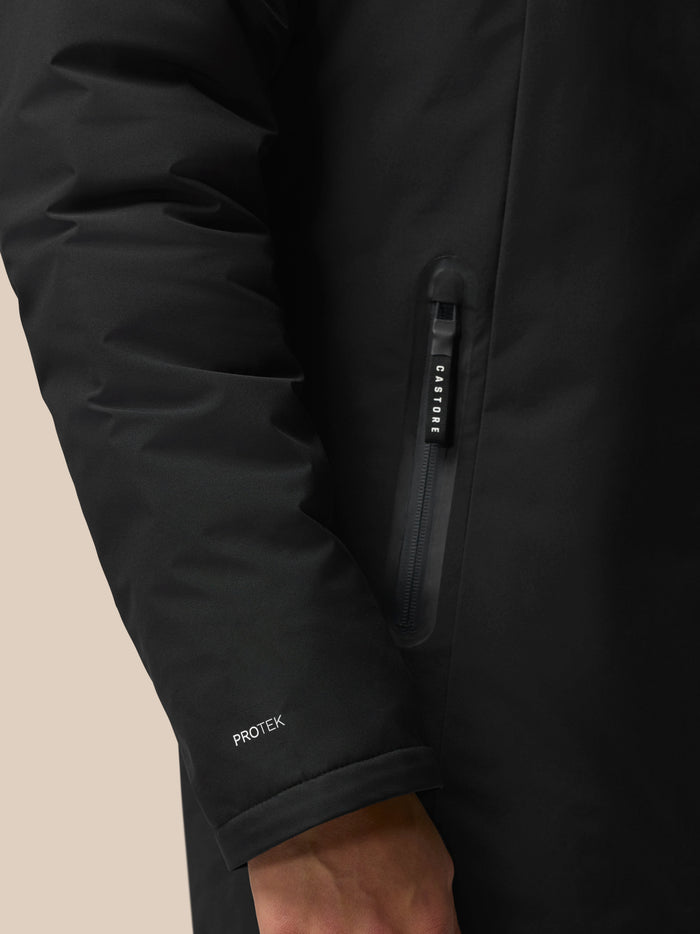 Close up of a black Castore jacket zipper with a CASTORE branded pull