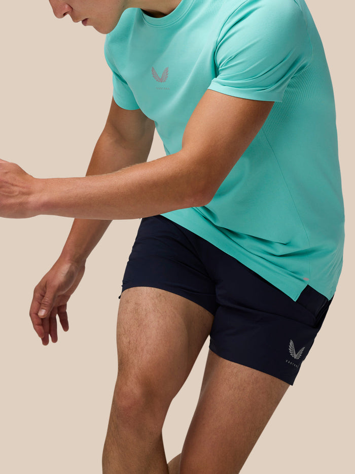 Close-up of a man wearing a light aqua Zone Training T-Shirt showing the chest logo.