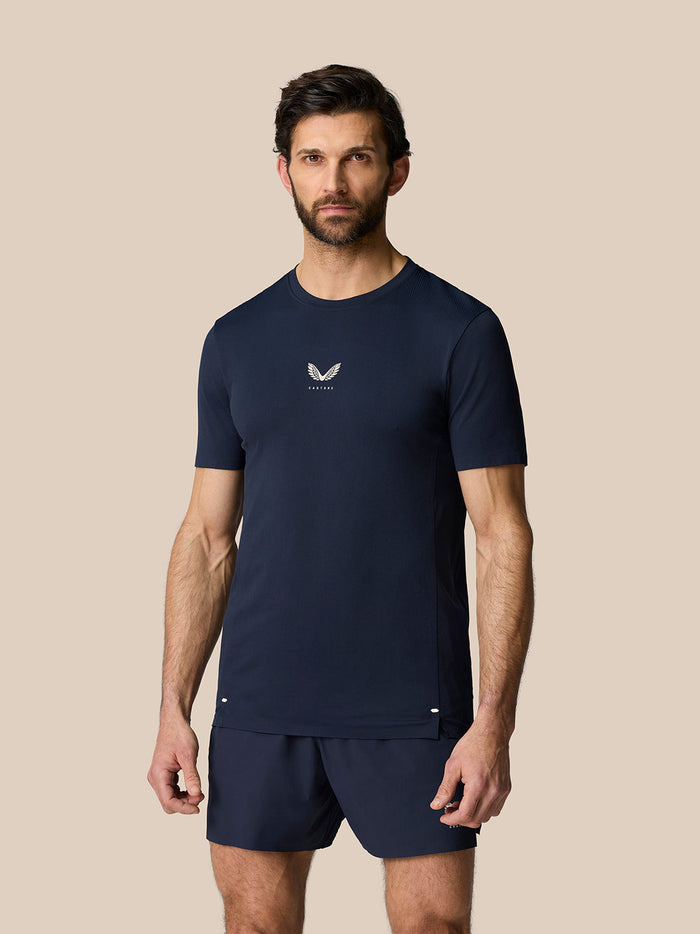 Man wearing navy Zone Training T shirt with small chest logo and athletic fit