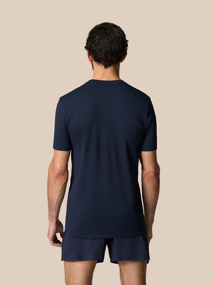 Back view of a model wearing Zone Training T-Shirt in midnight navy with a relaxed fit