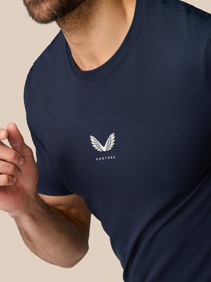 Close up of navy Zone Training T-Shirt showing a white wing logo on the left chest