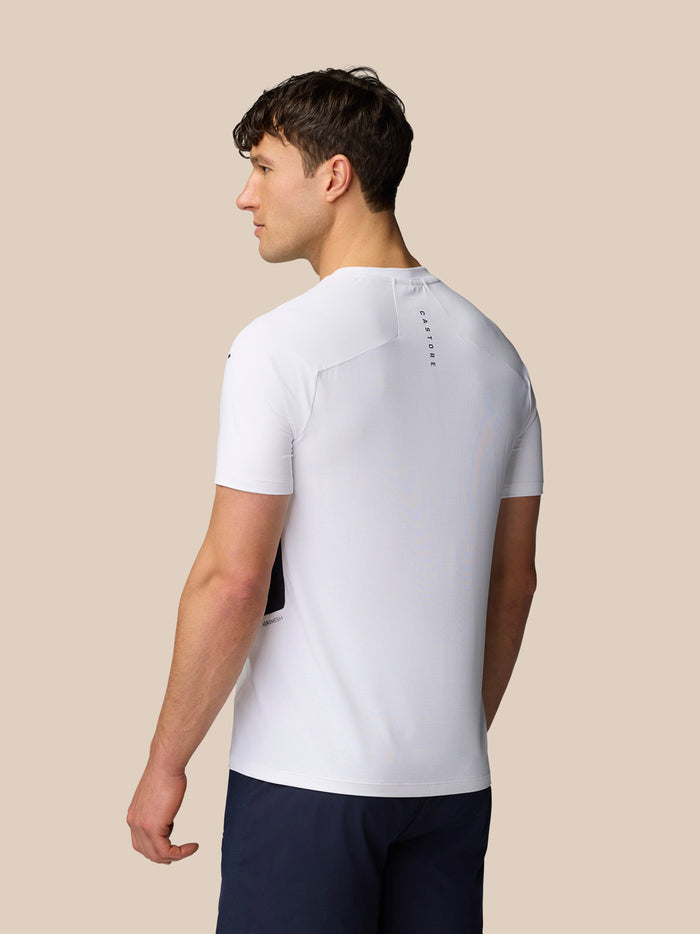 Back view of white Apex Training T-Shirt with Castore branding running down the upper back.