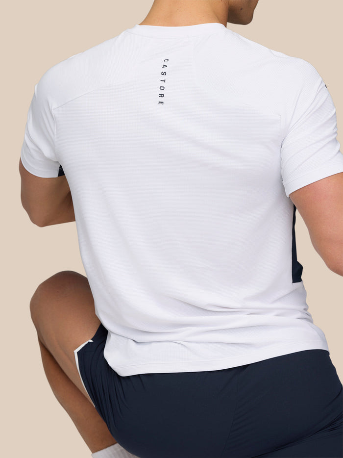 Back view of white Apex Training T-Shirt featuring vertical Castore branding along the spine.