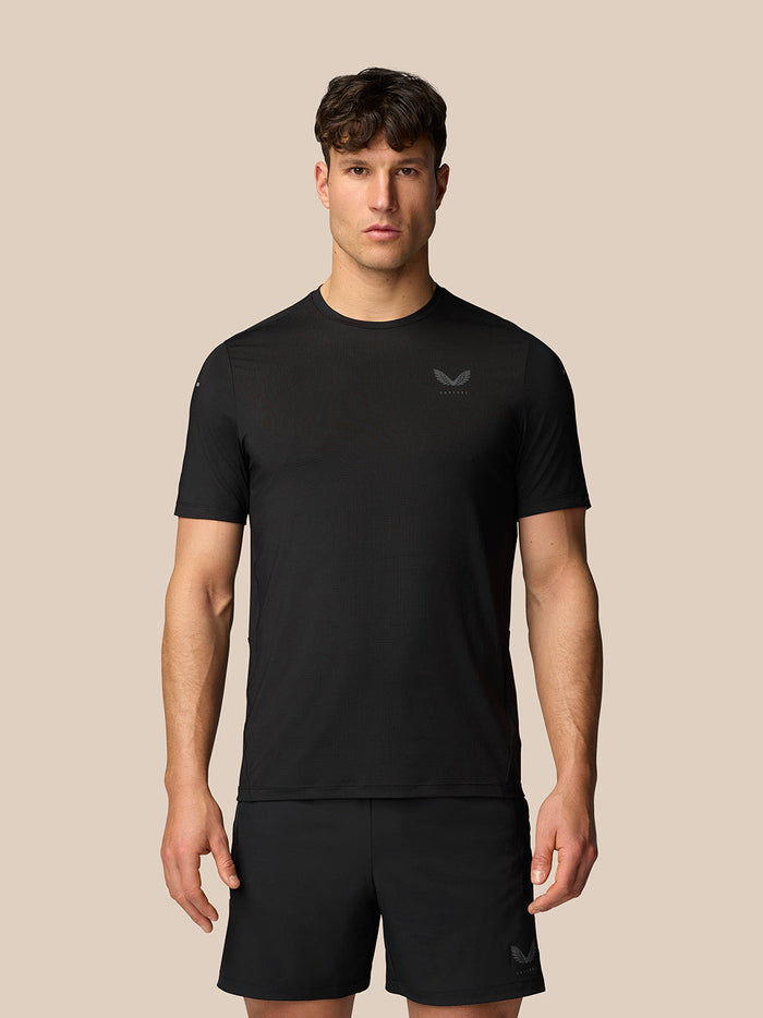 Man wearing black Apex training T shirt with crew neck and short sleeves