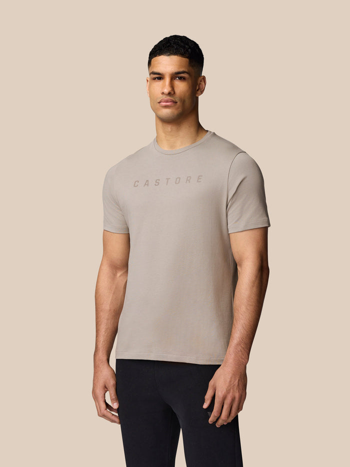 Male model in Rock Grey Graphic Lifestyle T-Shirt with crew neck and short sleeves.
