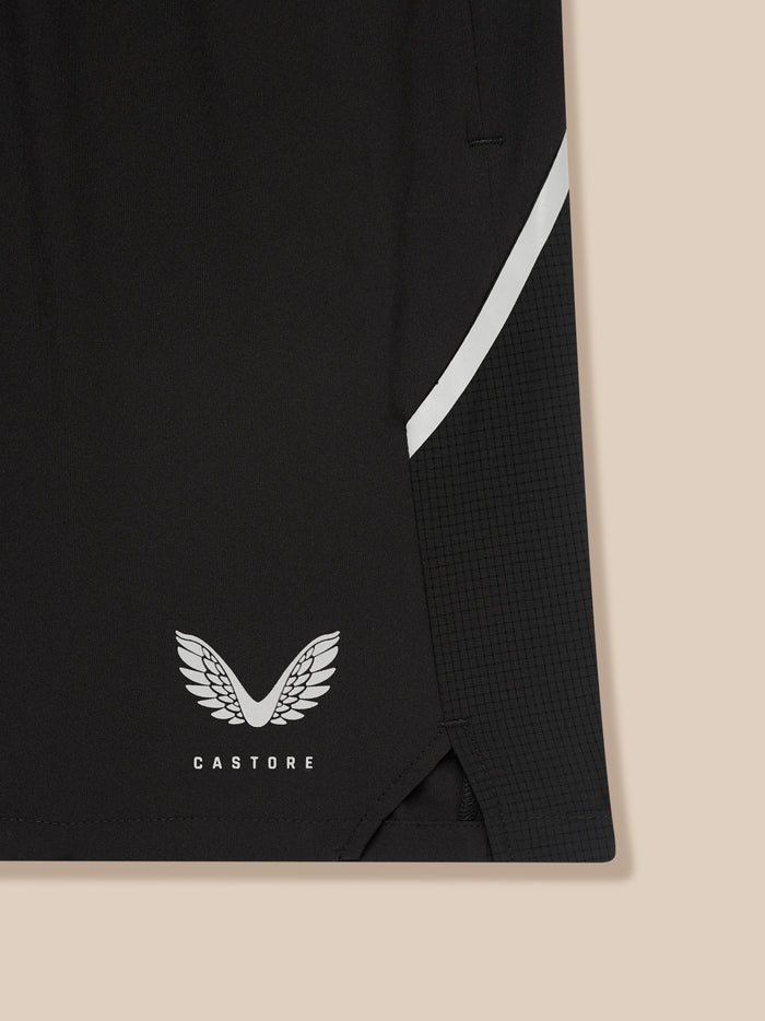 Close up of black Apex shorts fabric with a white side stripe and Castore emblem near the bottom