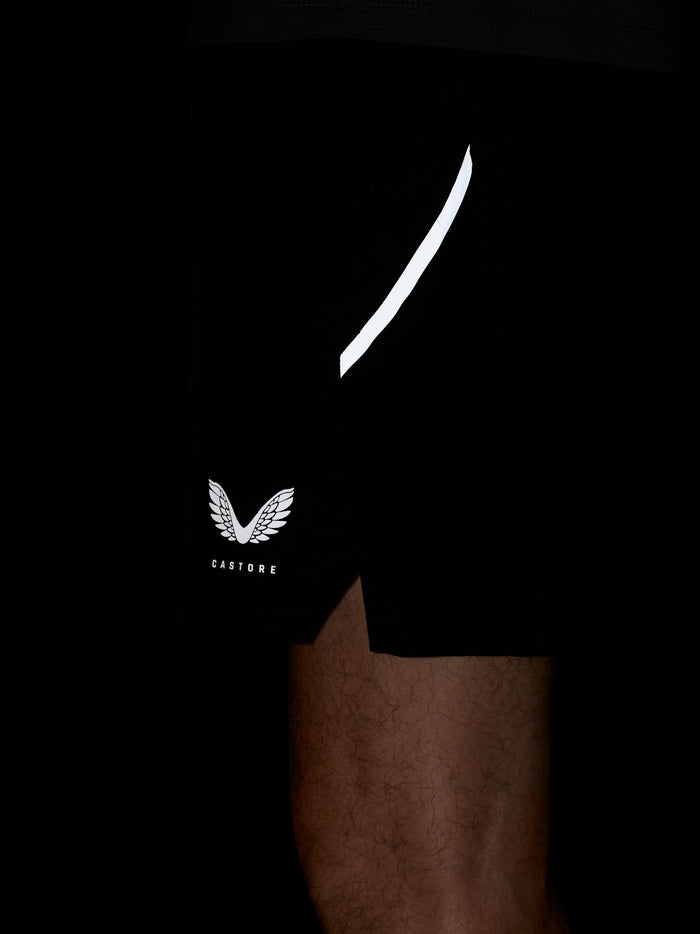 Apex Training 6 inch shorts in black with a white curved side stripe and Castore logo on the left leg
