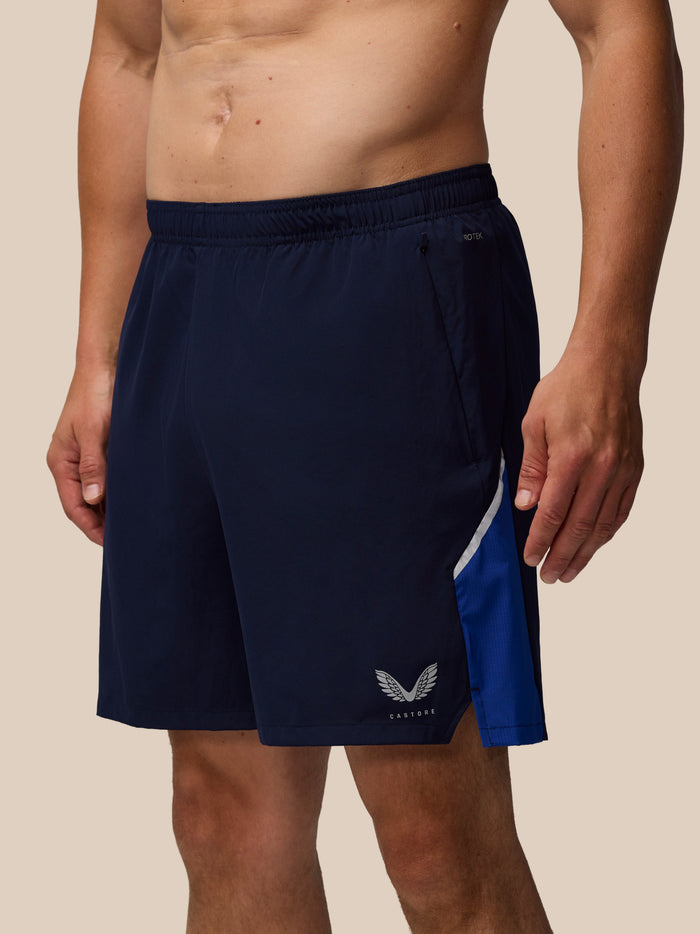Navy Apex 6 inch training shorts with elastic waist and Castore wing logo on the leg