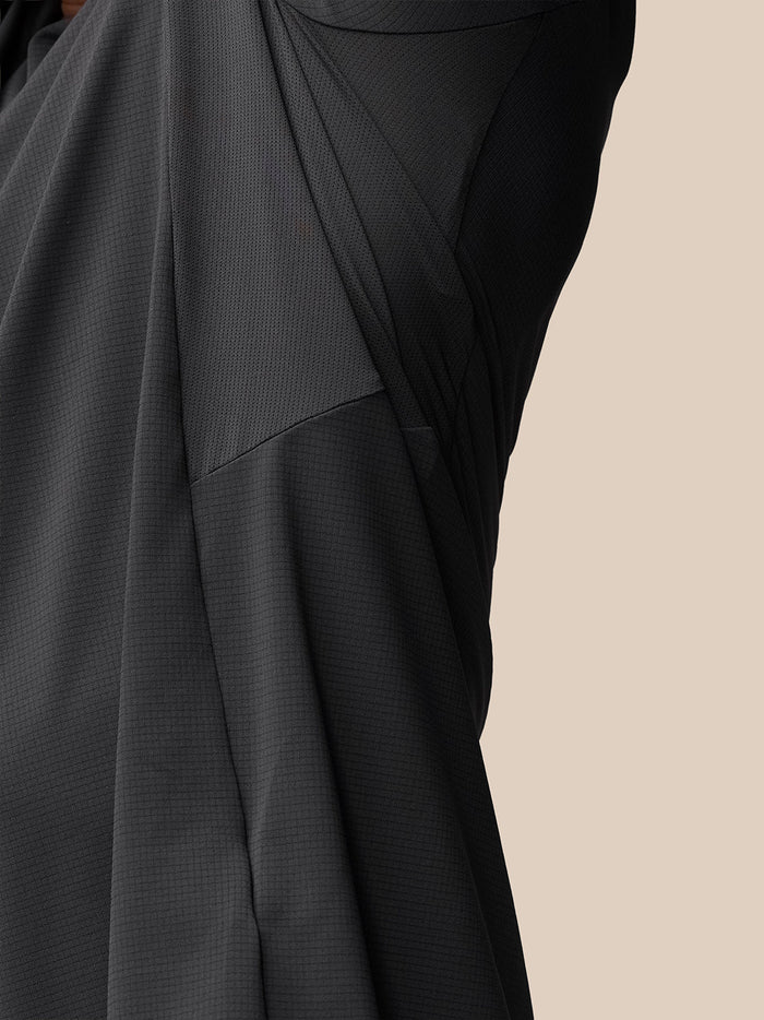 Close up of mesh panels and textured fabric on the Apex Training T Shirt with Castore wordmark at the back hem.