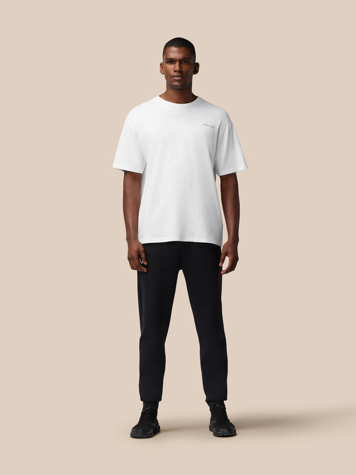 Three quarter front view of white Flex Cotton T Shirt with CASTORE logo on the chest