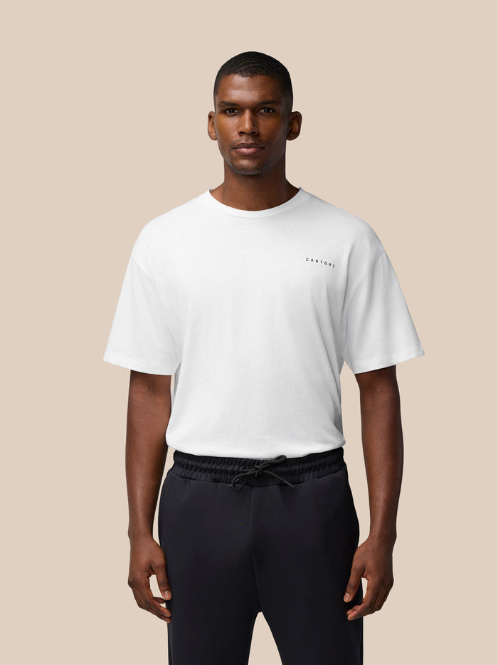 Male model wearing white Flex Cotton T Shirt with CASTORE logo on the chest