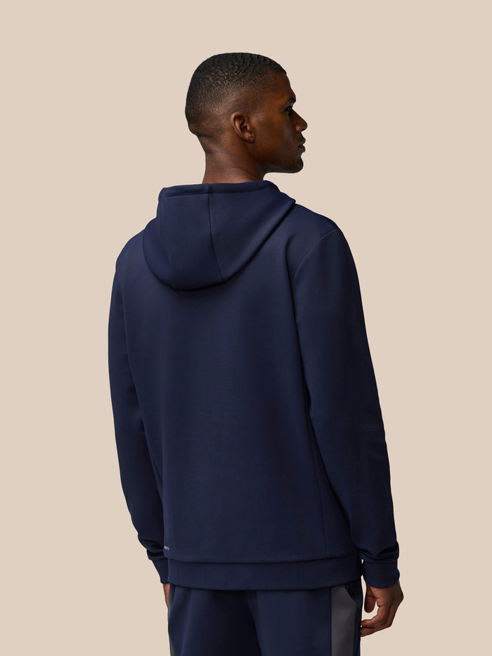 Back view of navy Flex Lifestyle Thermo Hoodie on model with hood up