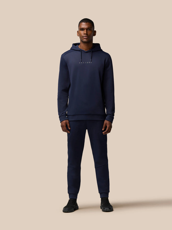 Three-quarter front view of navy Flex Lifestyle Thermo Hoodie showing Castore logo on chest and drawcords