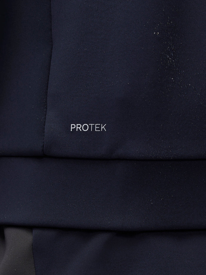 Close-up of navy Flex Thermo Hoodie fabric with ProTek logo and water droplets