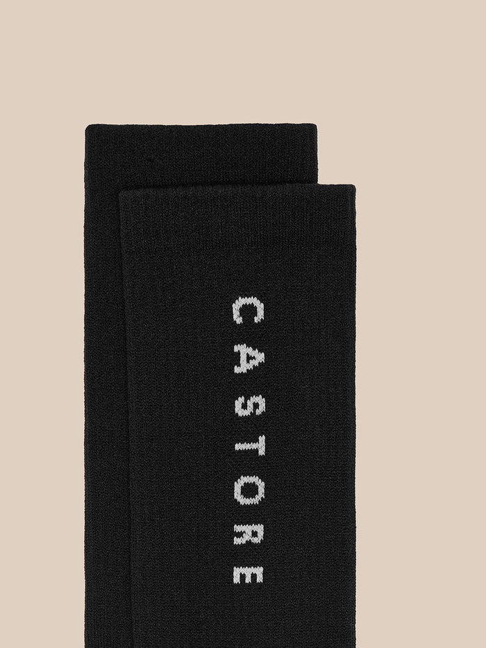 Black Castore Active Crew Socks stacked, logo running vertically along the leg.