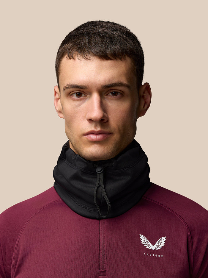 Model wearing a black active snood around the neck for training