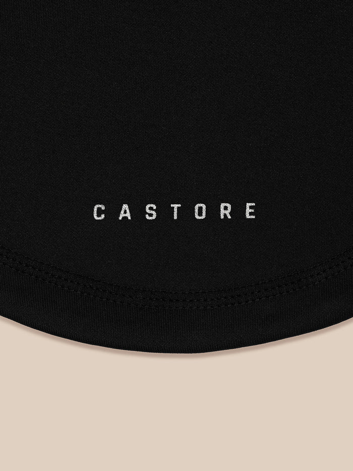 Close-up of black snood fabric with Castore branding along the edge