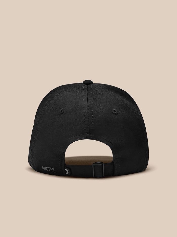 Back view of a black nylon cap with an adjustable strap and PROTEK branding at the rear