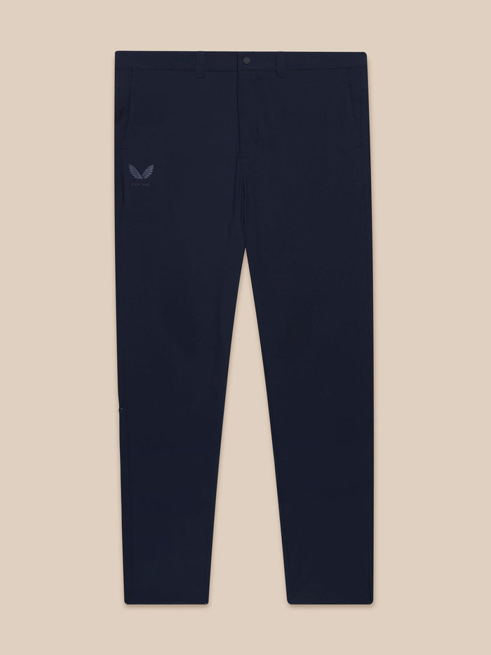 Front view of Midnight Navy Golf Club Trousers laid flat, displaying waistband pockets and Castore logo