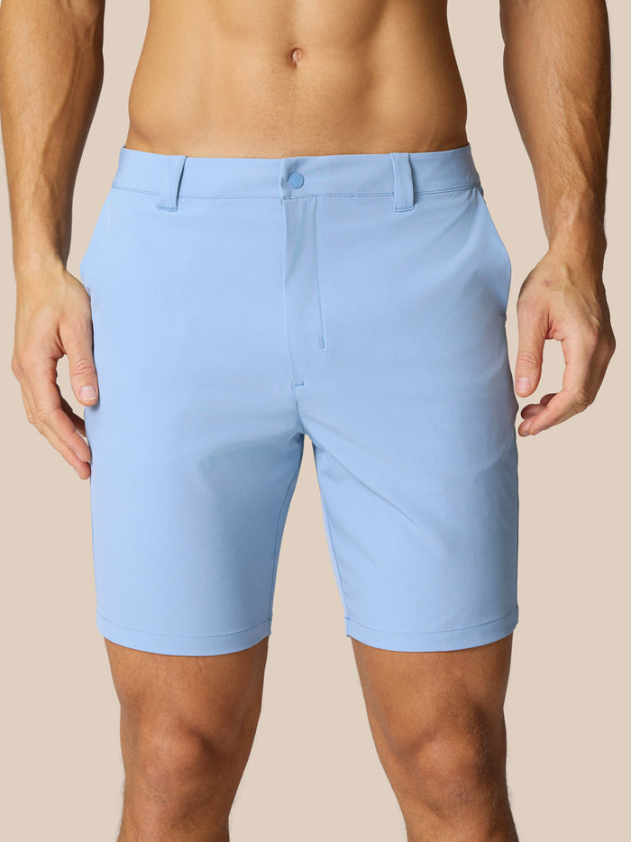 Front view of sky blue golf shorts with belt loops and side pockets.
